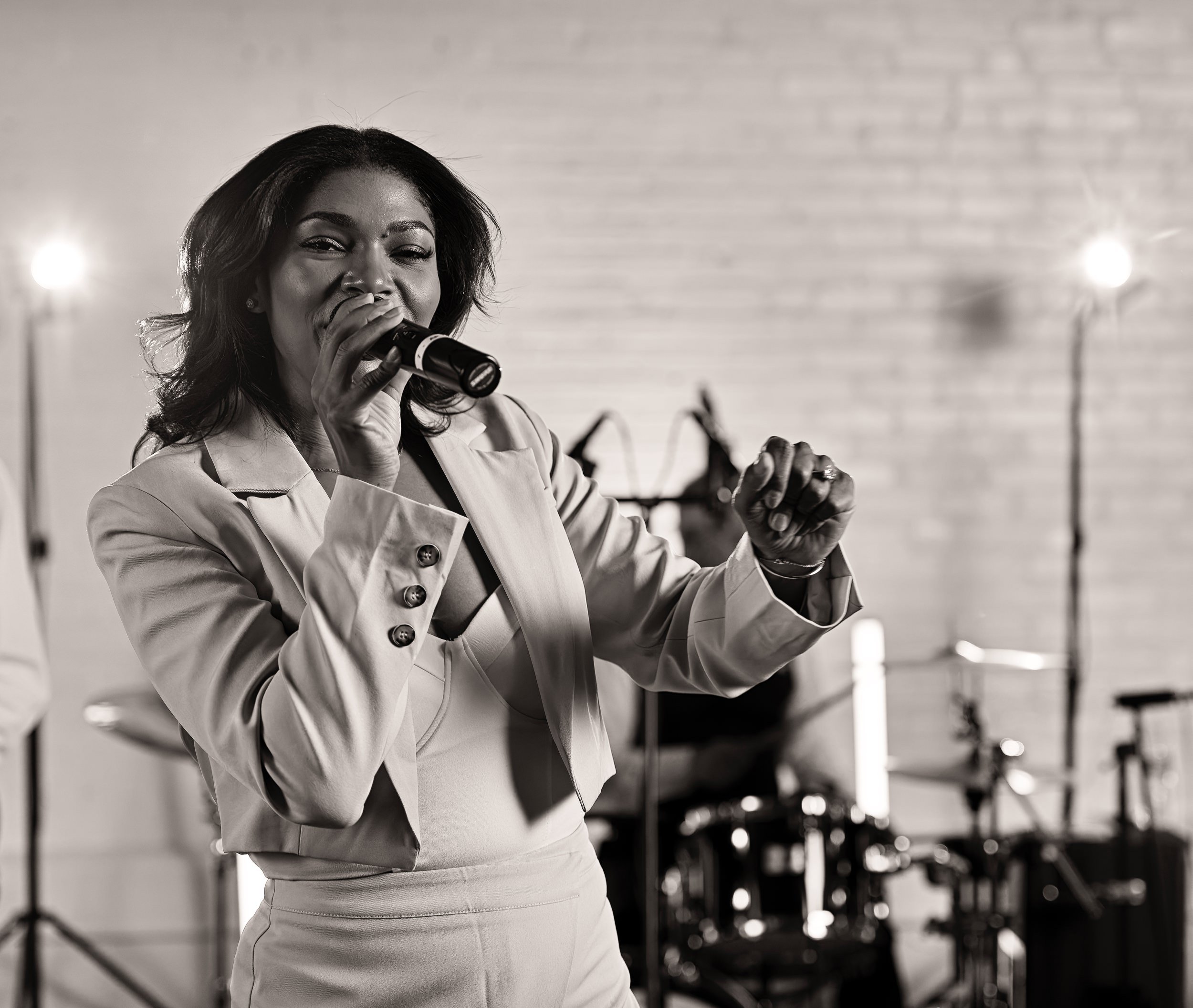 Female lead singer during production stills of Lucky 13 at Warehouse XI in Somerville, Massachusetts for Hank Agency Group.