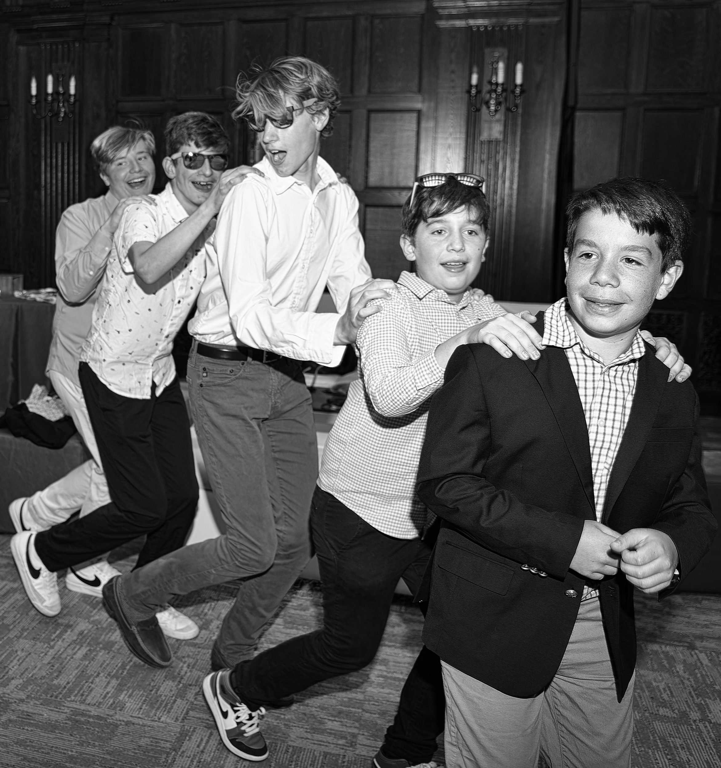 A line of boys dance during the hora at a Brookline, MA Bar Mitzvah party