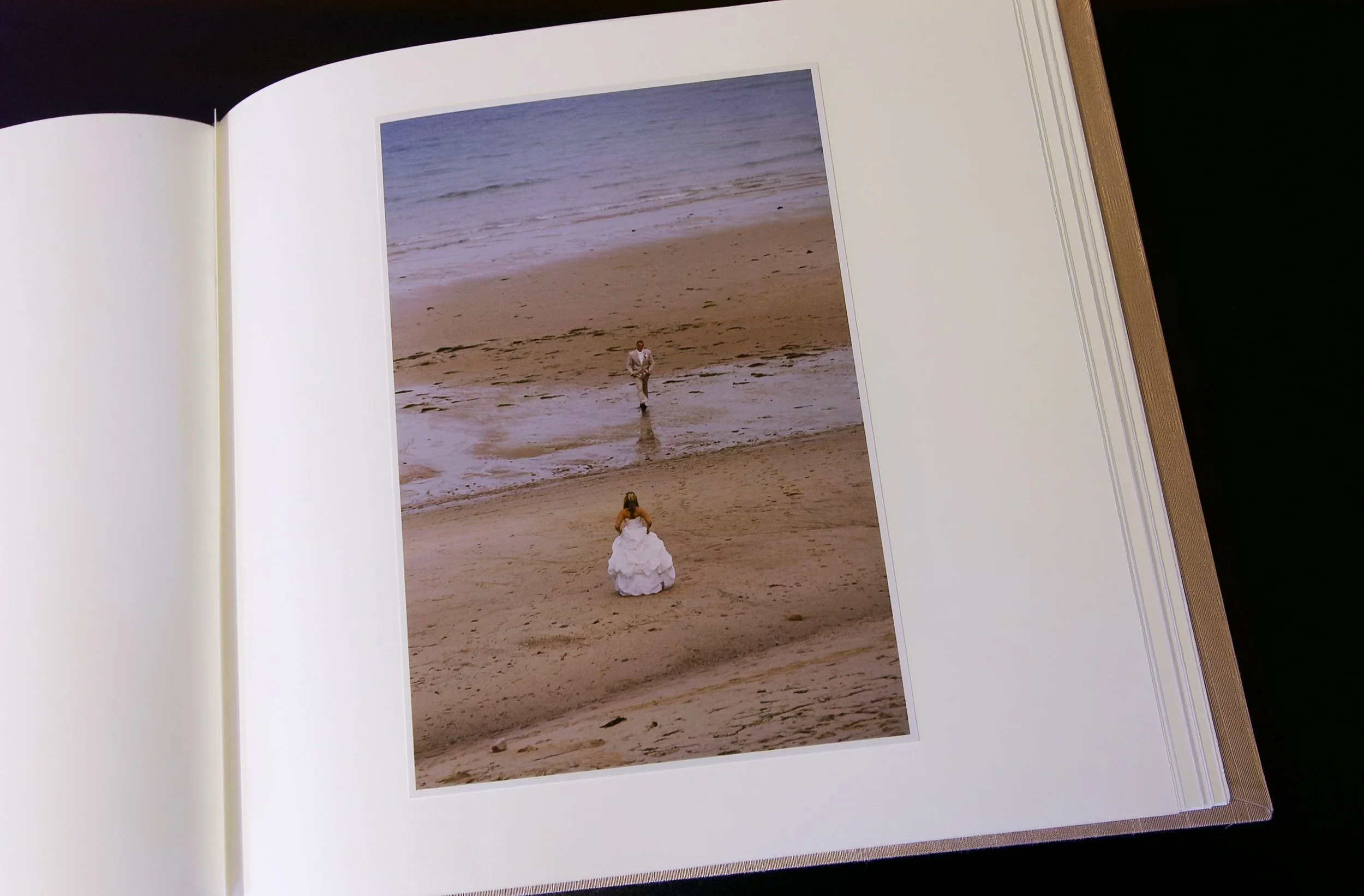 Open album with single color photograph