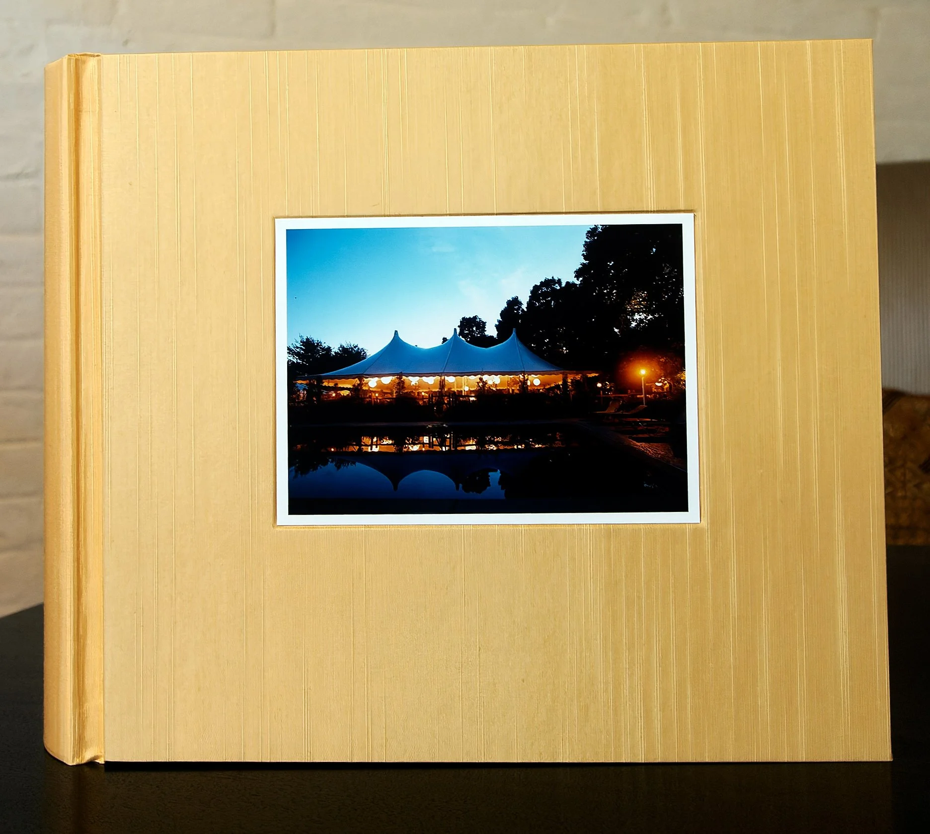 Framed landscape photograph in a custom album cover with rich yellow silk