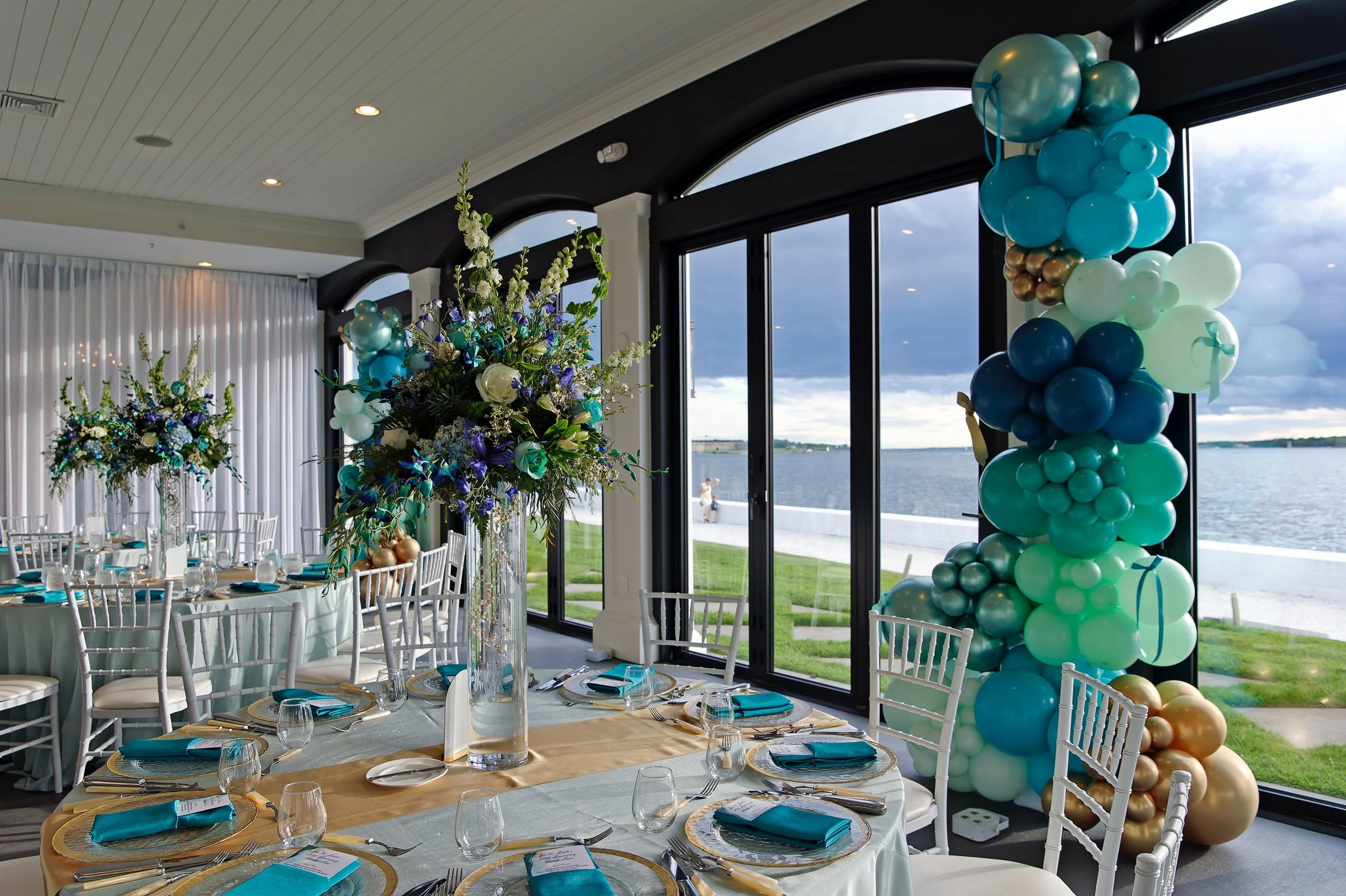 Reception table setting prepared for the anniversary dinner at Belle Mer