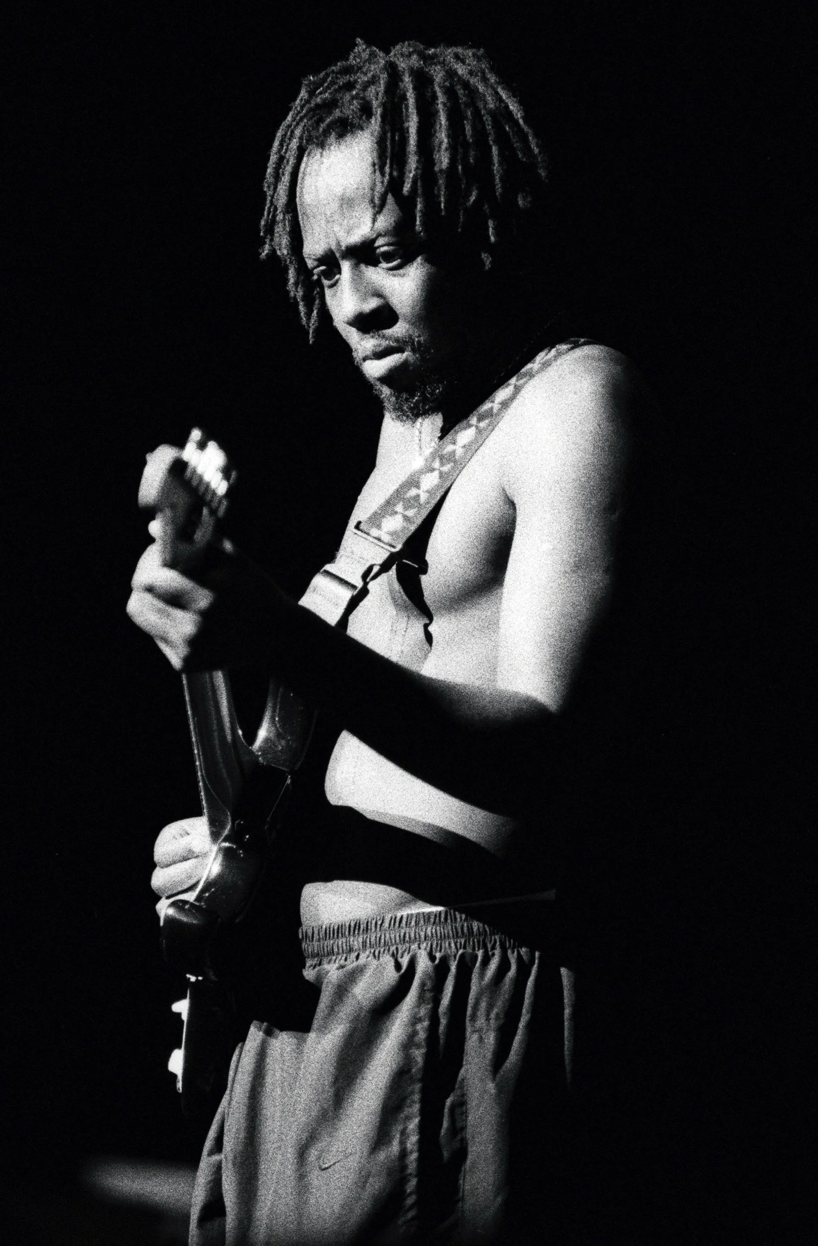 Hip hop artist Wyclef Jean photographed performing live on Kodak black and white film