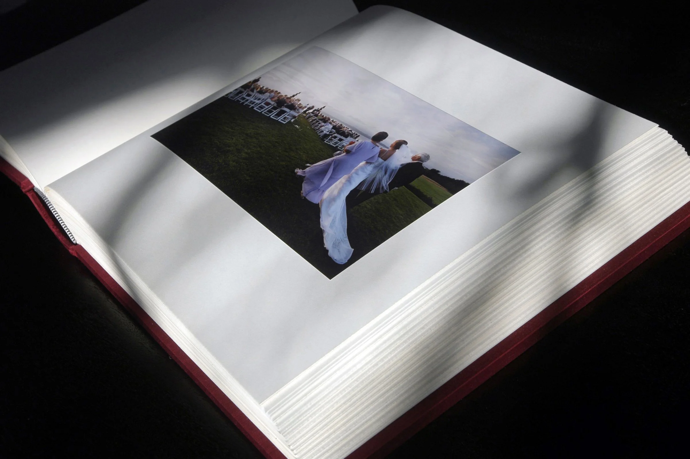 Custom made album with prints hand-mounted onto rag pages.