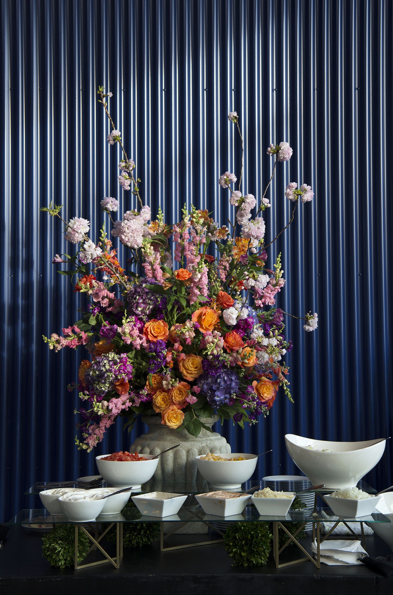 Catering display by Russell Morin Catering & Events and floral arrangement by Sayles Livingston Design