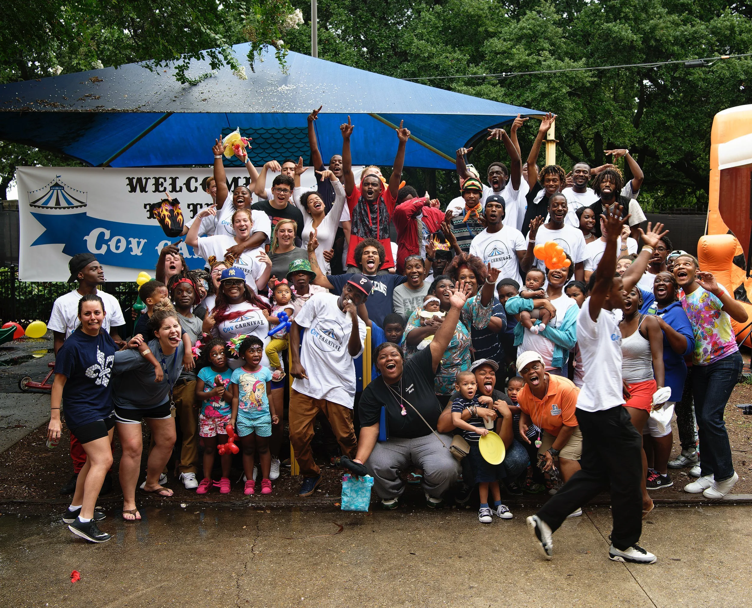 Volunteers, Covenant House staff, and families gather for a group portrait at CovCarnival, celebrating community, resilience, and hope in New Orleans.