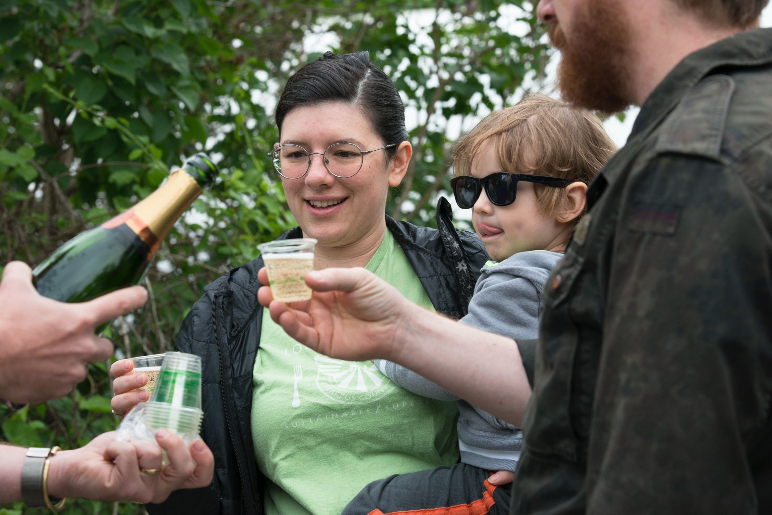 Visitors raising a toast during the Southside Community Land Trust Annual Plant Sale.