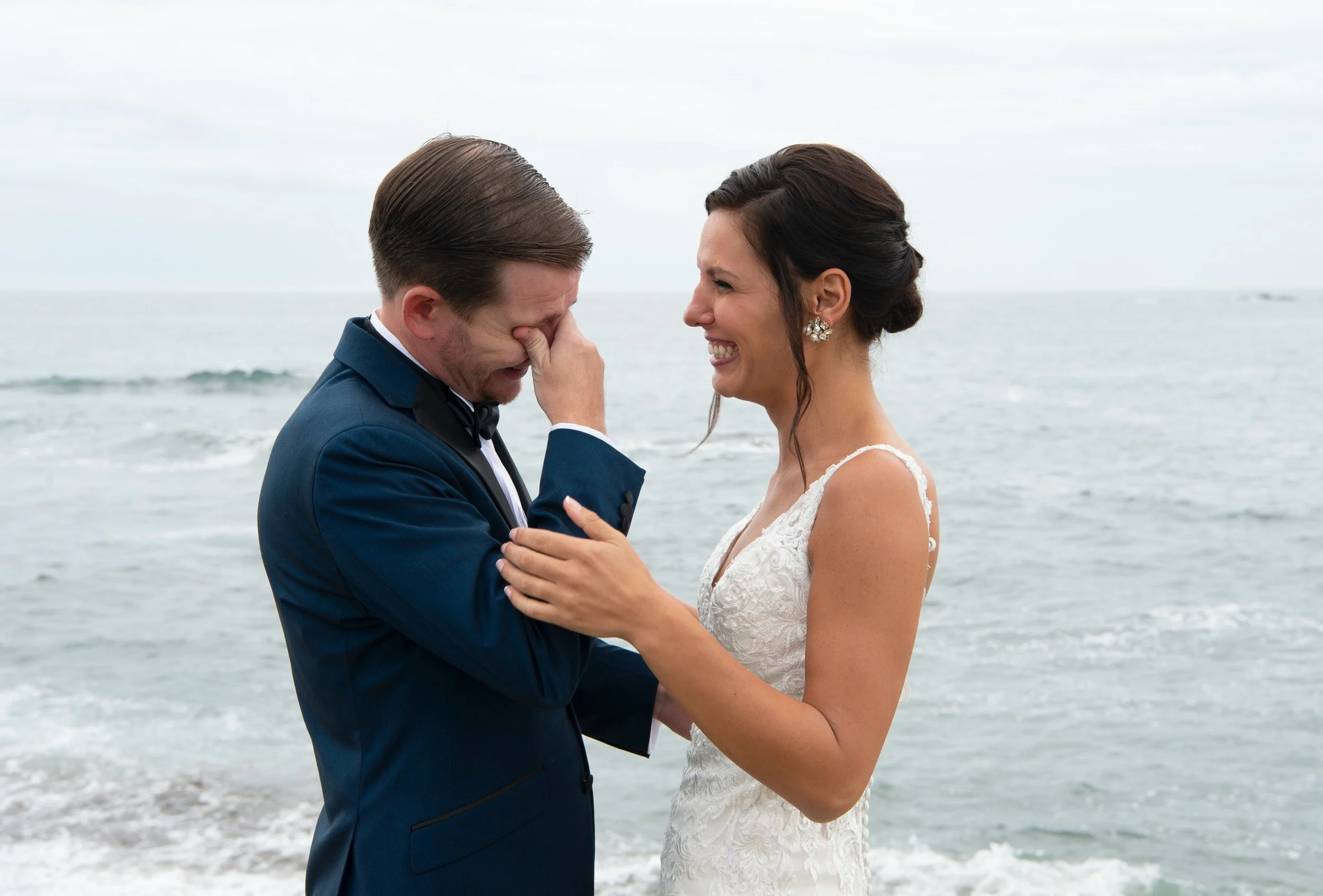 Emotional groom during first look at Brenton Point State Park in Newport, RI