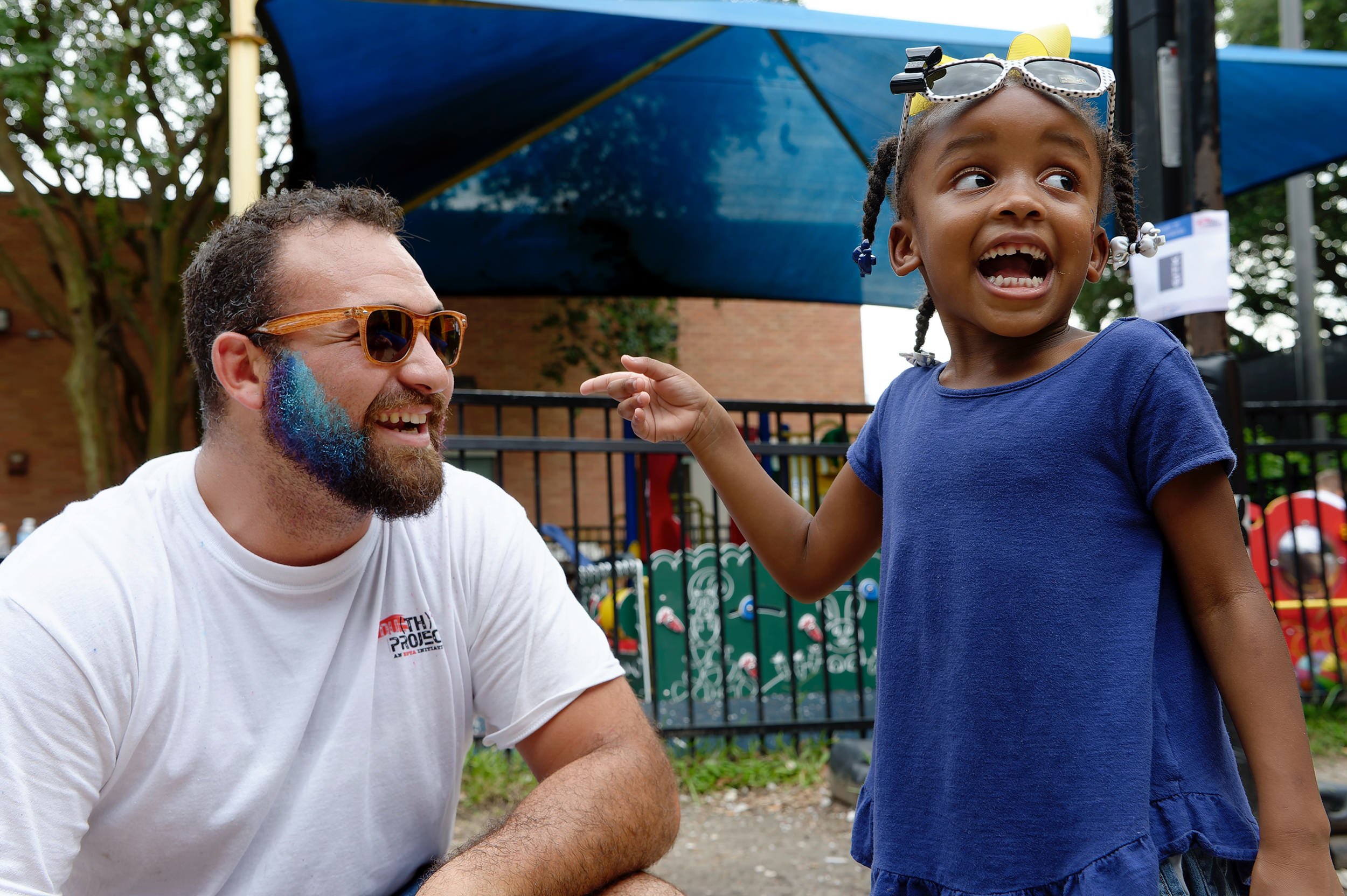 David Lombardo makes little girl laugh during Cov Carnival event for Covenant House in New Orleans
