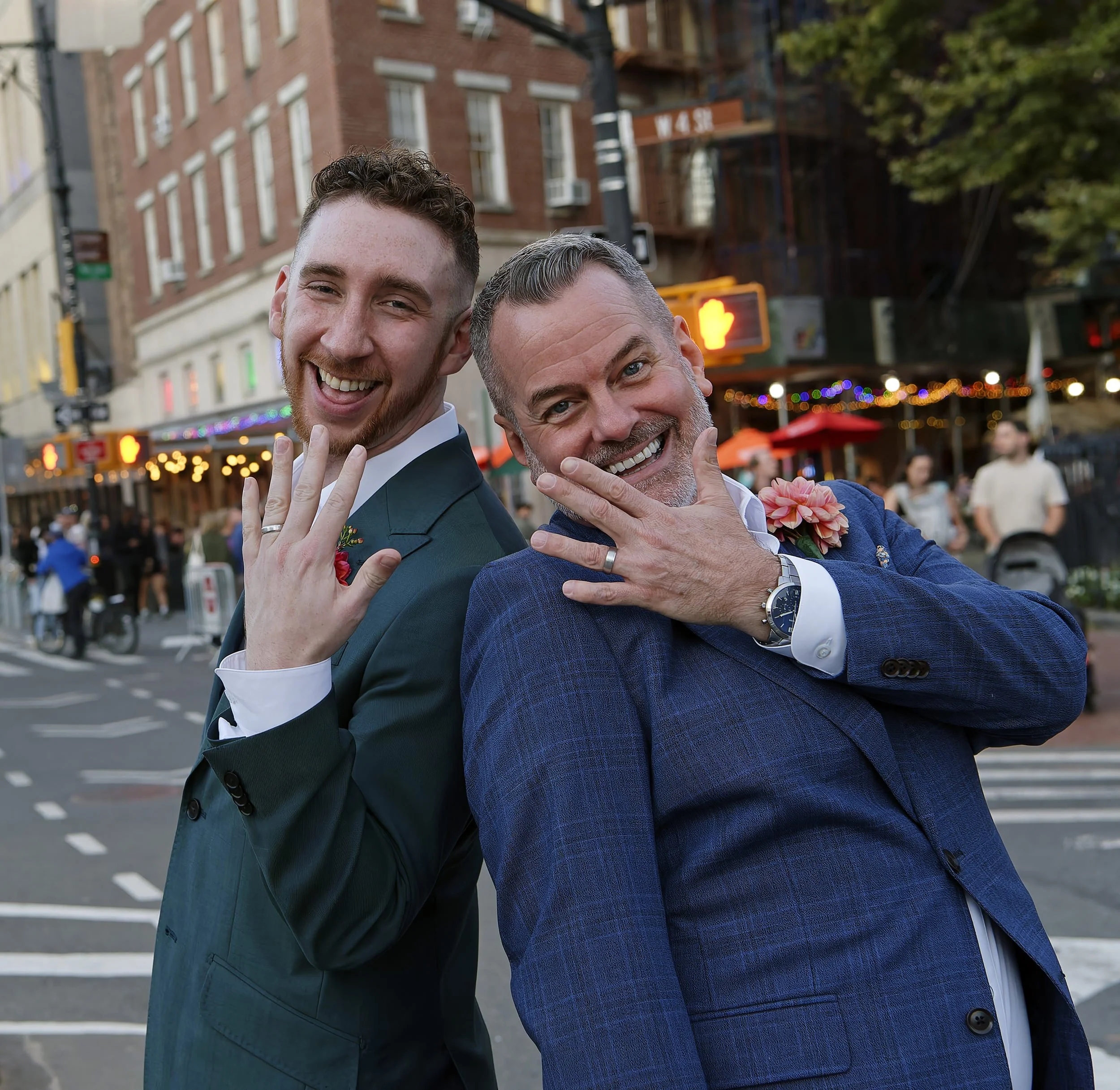 Two happy grooms in the middle of an intersection in the West Village, New York City.