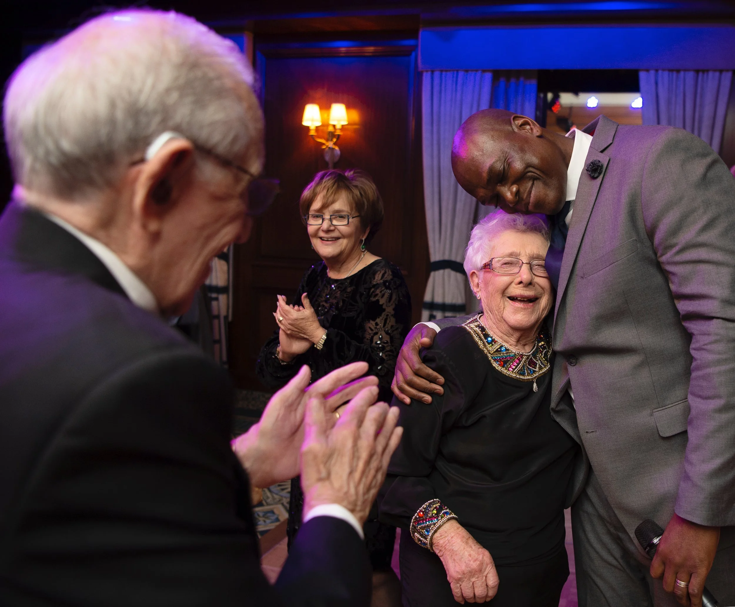 Guests laughing together during the anniversary celebration.