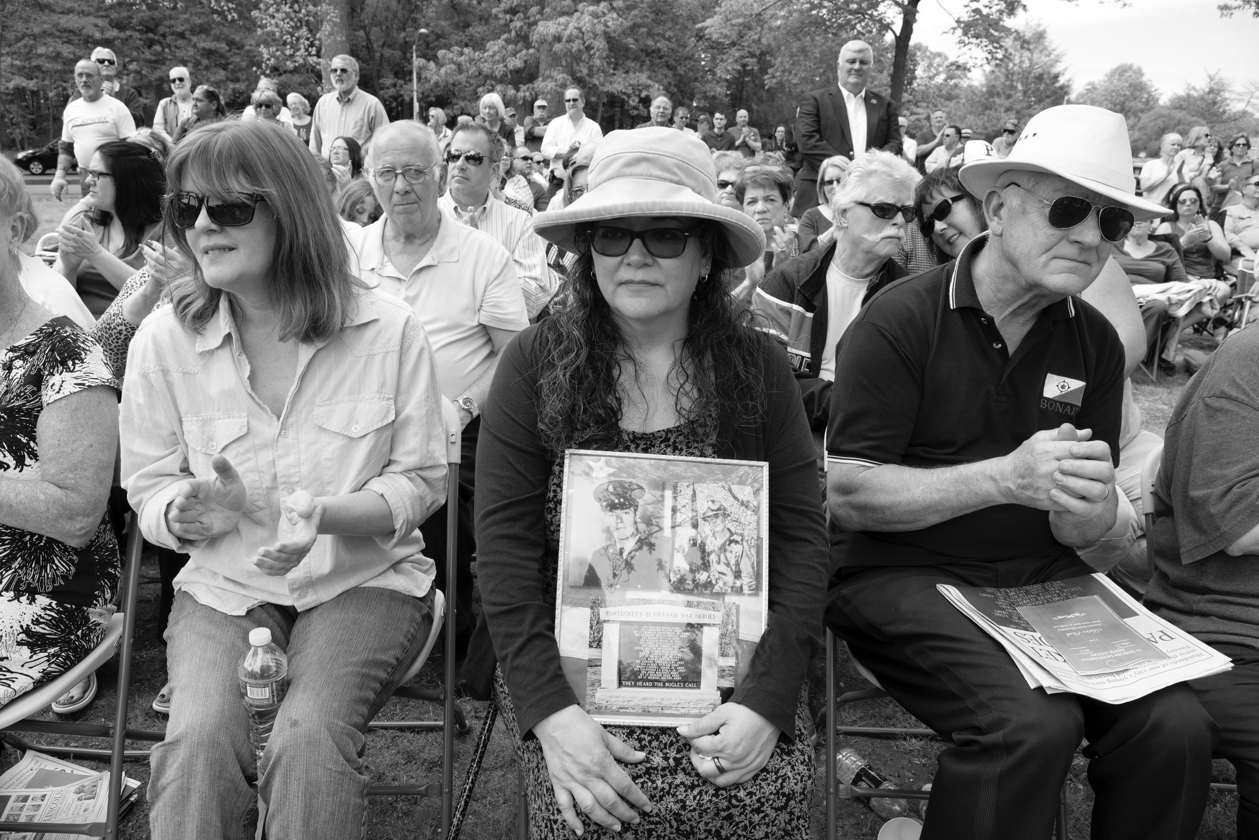 Family members seated together during the 21 Heroes remembrance ceremony.