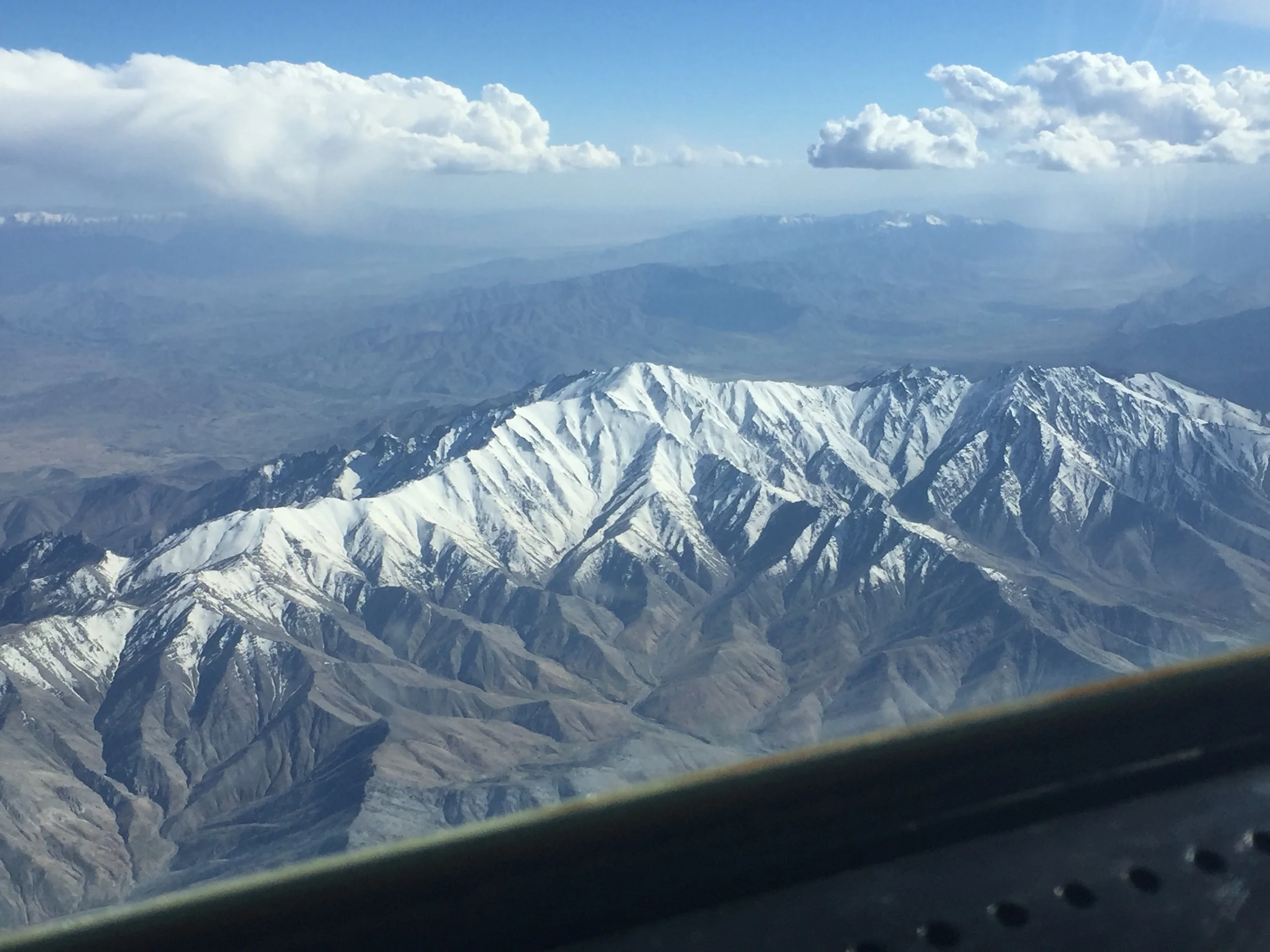 The view from the cockpit, flying over the snow-capped mountains of Afghanistan.