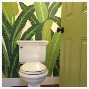 Small water closet gets huge impact with a vintage tropical wall panel purchased from eBay. The panel is only 54" wide and perfect for the tiny room. Entry door gets punch of bright green to ease into the room.
