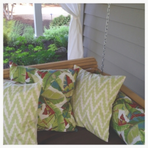 A covered porch is the perfect place for a nap on hot days, or sleeping alfresco. The twin-sized pine swing bed was ordered on eBay and the pillow covers were custom made from a seamstress on etsy.