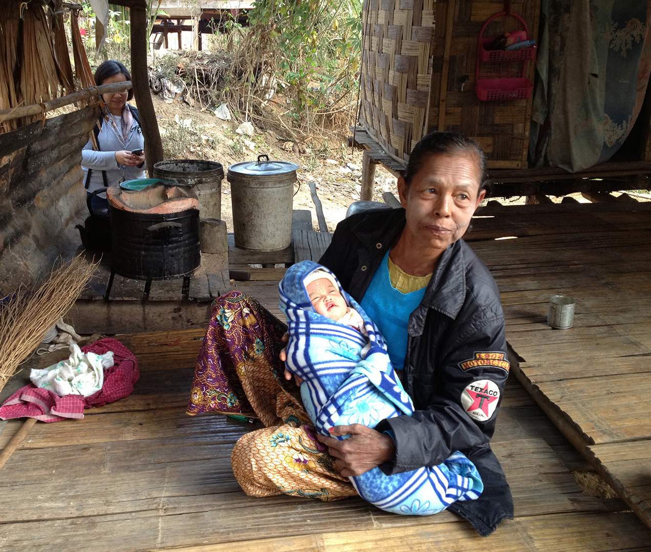 A days-old newborn being cared for (Ban Mai community)