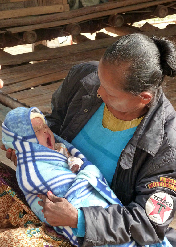 A newborn being cared for