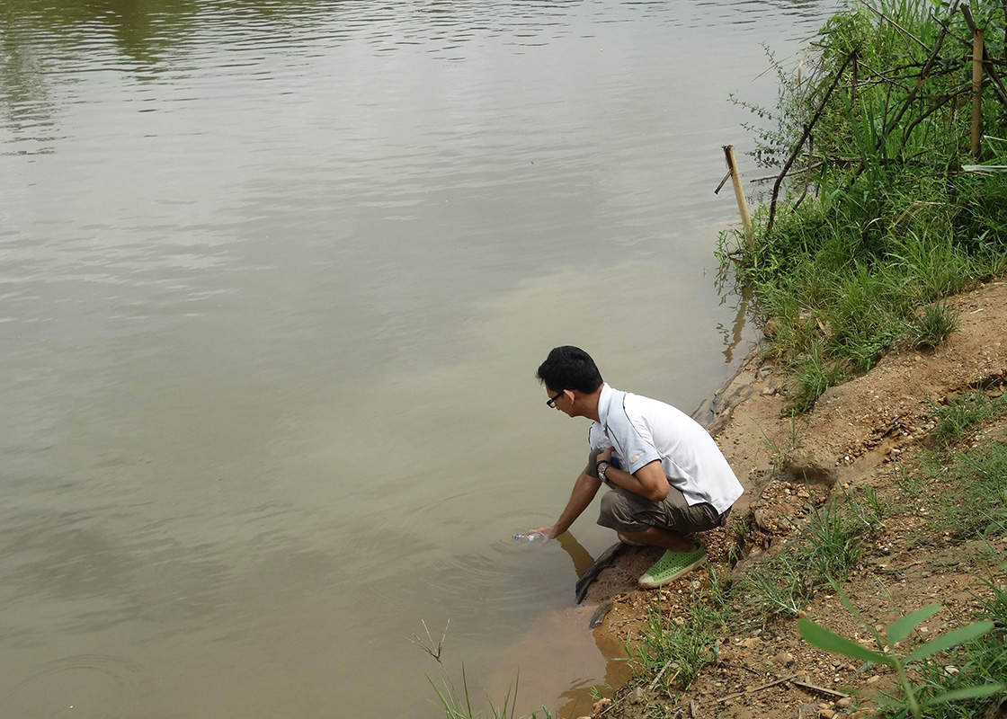 Collecting water samples from Ban Mai