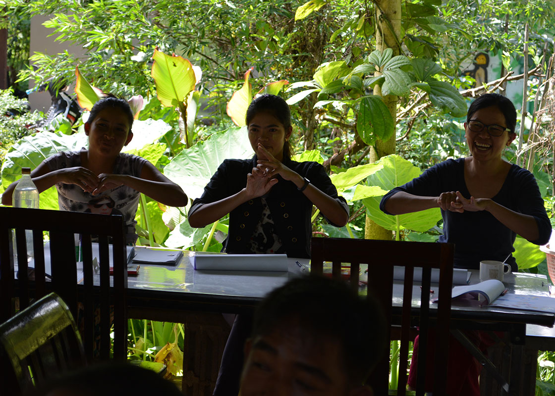 Learning the proper hand-washing steps.