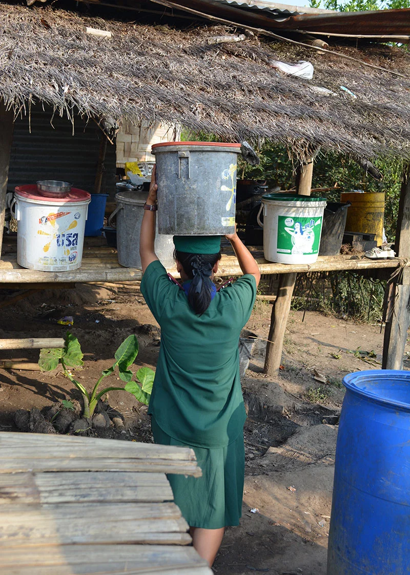 Early evening is also when young family members in Fung Na fetch water from the nearby spring, which is their water source.