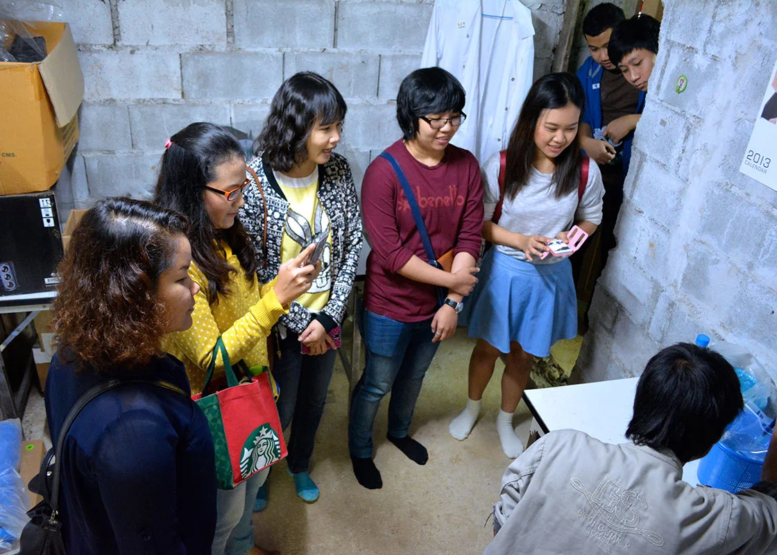 Taedee demonstrated how the coliform testing was done with Petrifilms.