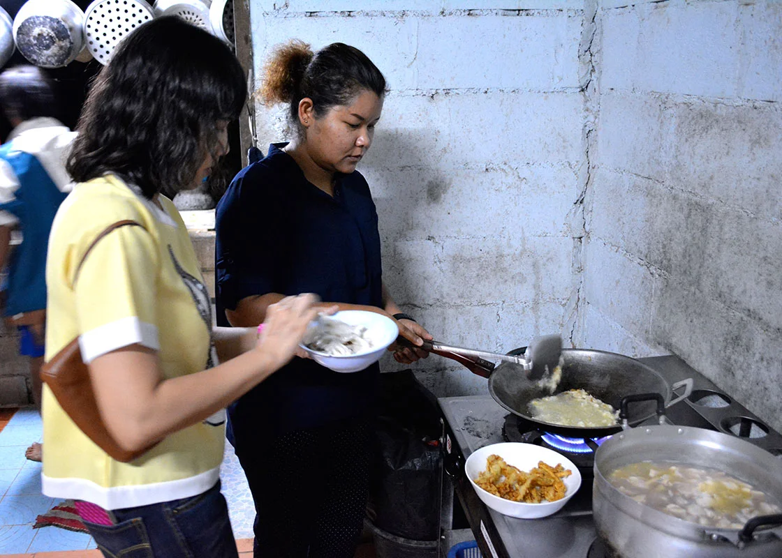Supamas and Saisamorn helped make dinner.
