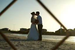 Beach weddings are very Australian. Here the couple enjoy a romantic kiss at Jurian Bay, Western Australia.