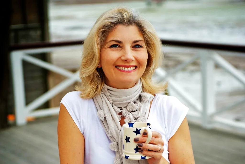 A great picture of a Mum enjoying her coffee during her family photos by Warnock Imagery