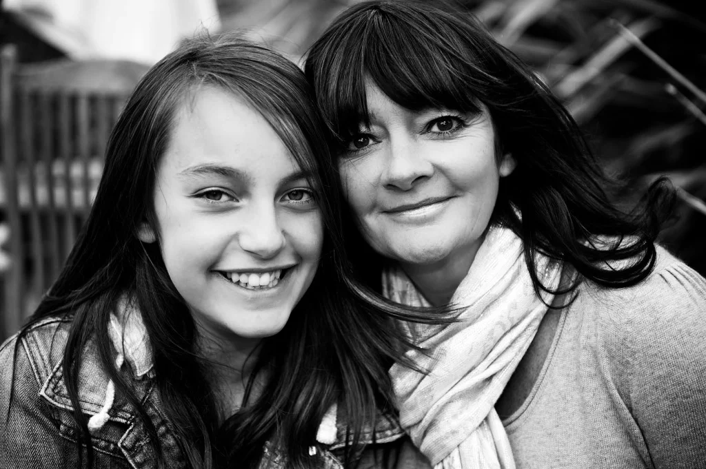 A Mum and daughter share a hug during a photograph session. Image taken by Warnock Imagery