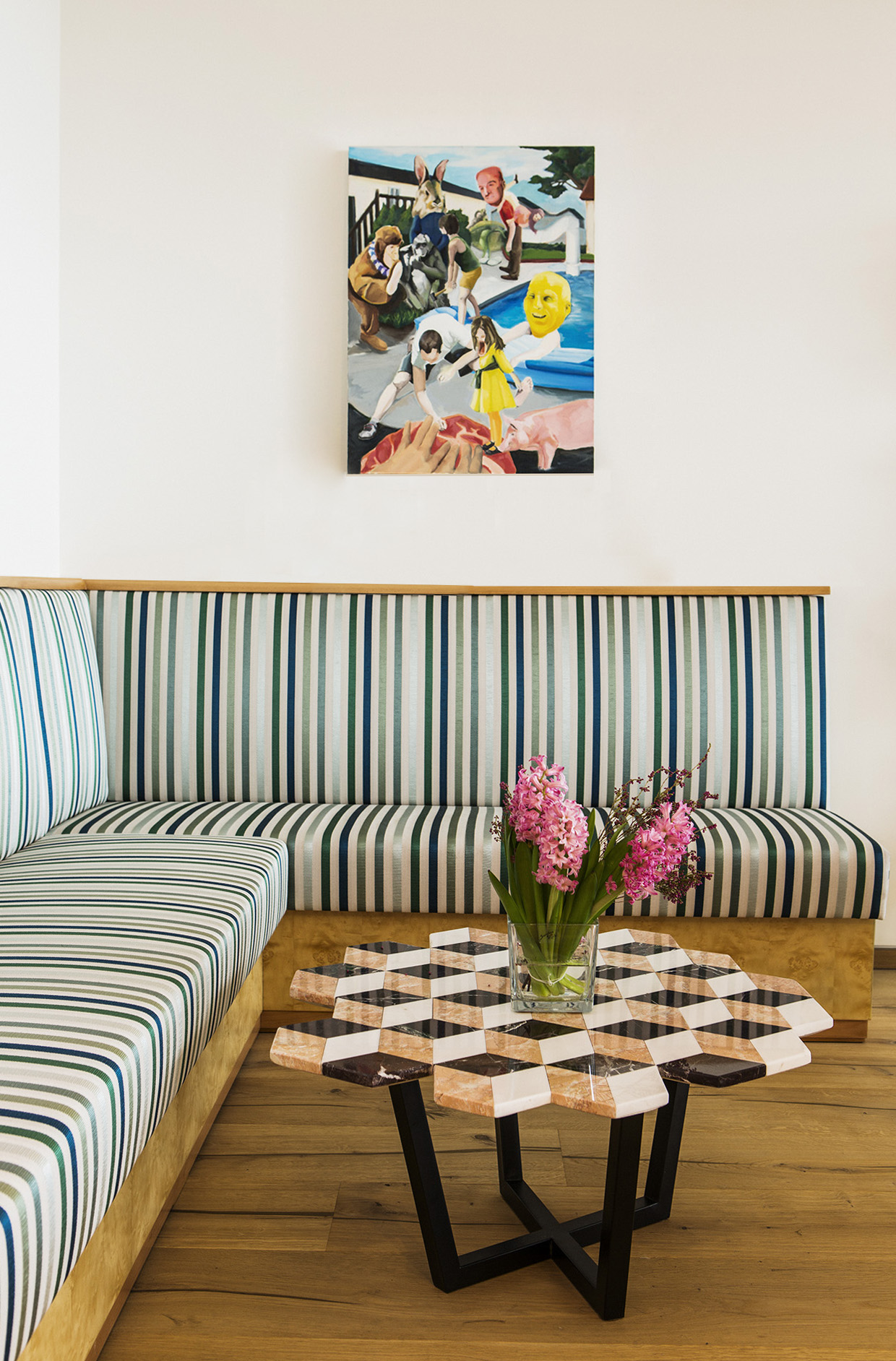 Custom banquette with Hermes upholstery and diplopia side table.