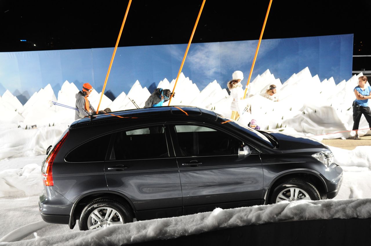 Car driving through snow scene set.