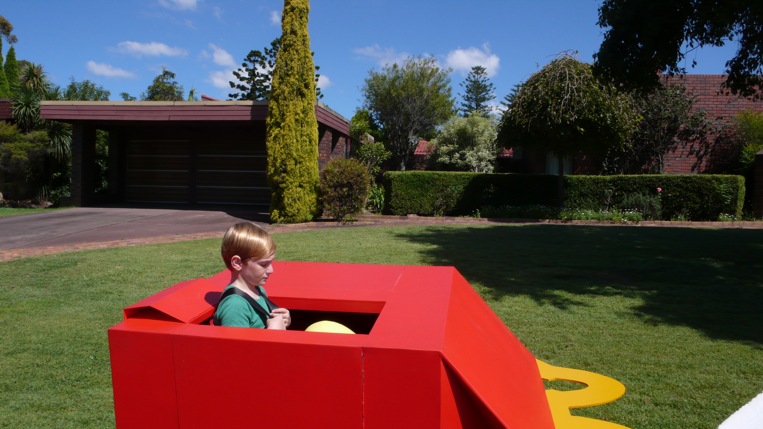 oversized happy meal box as a small car