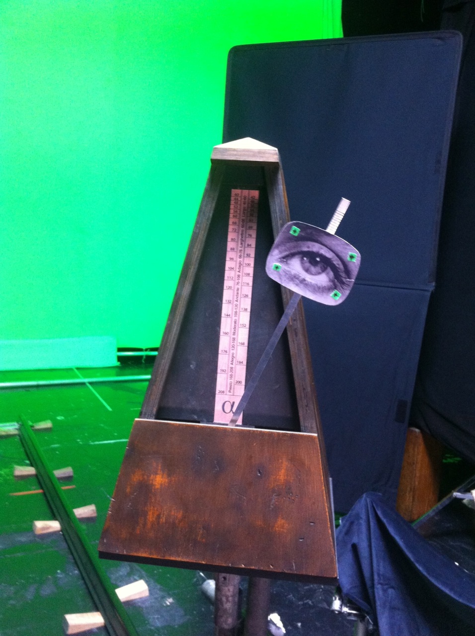 oversized metronome prop on set