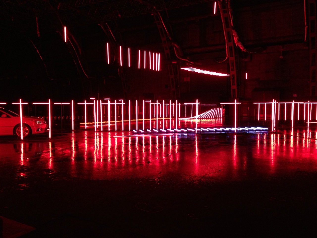 Multiple configurations of tubes hung off ceiling grid to form the finished 'Z' in final camera position