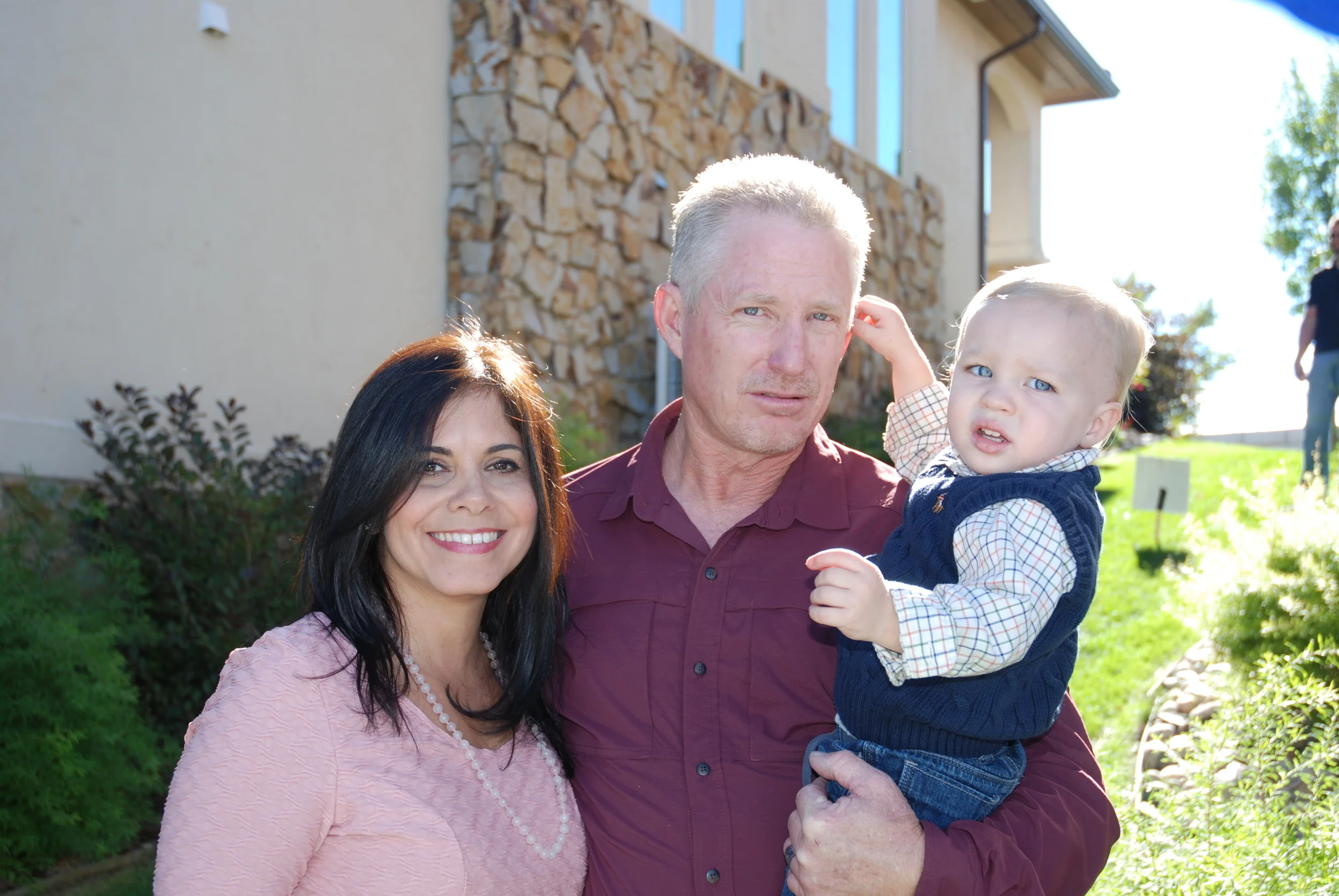 Zenaida and Doug with grandson, Kingston