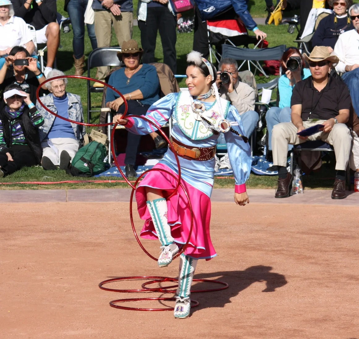  This dancer maintained a calm smile throughout her entire dance, which, considering your feet have to be in constant motion for the full seven minutes of dancing, seemed like an extra feat.  A small child (I assume her daughter) ran into the arena a
