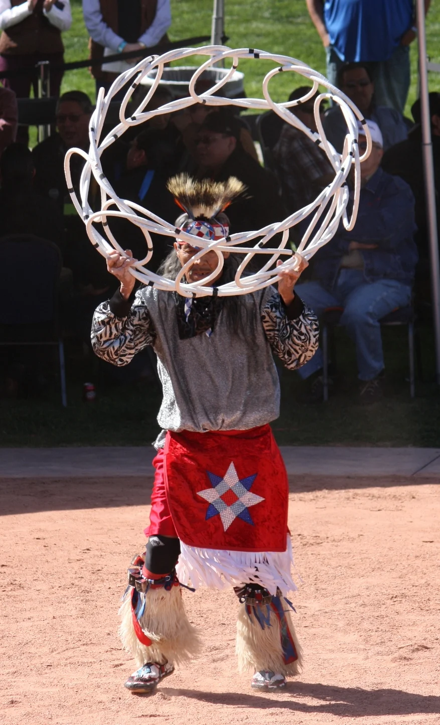 At the end, he took one of the smallest hoops (seemed waist-circumference) and somehow managed to fit himself all the way through. 