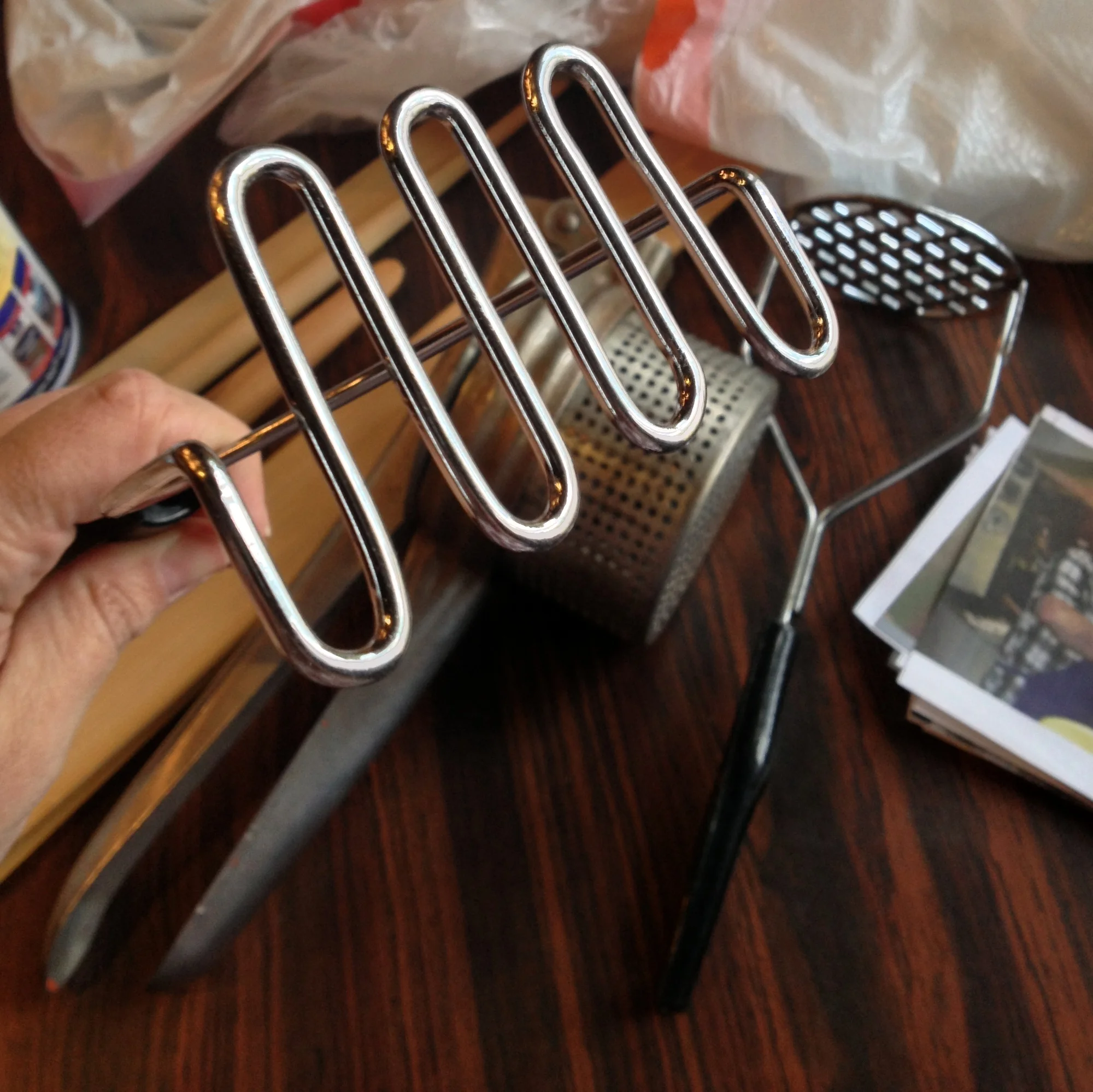  First, Mike showed us some tools you will need to make lefse. As mentioned, lefse is a potato-based flatbread, so you are going to need some form of potato masher or ricer. It's important for there to be no lumps, so personally, I'd rather use an ac