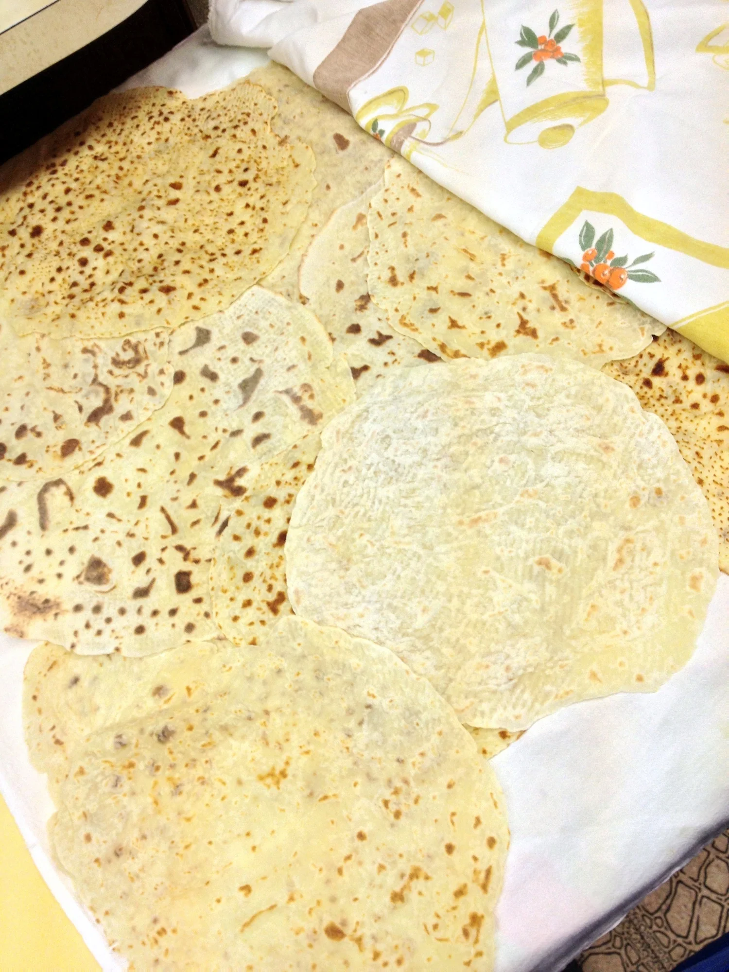  You'll want to make several, but you don't want them to dry out, so sandwiching the finished lefse between two sheets or towels will help keep them pliable and moist while you finish cooking. 