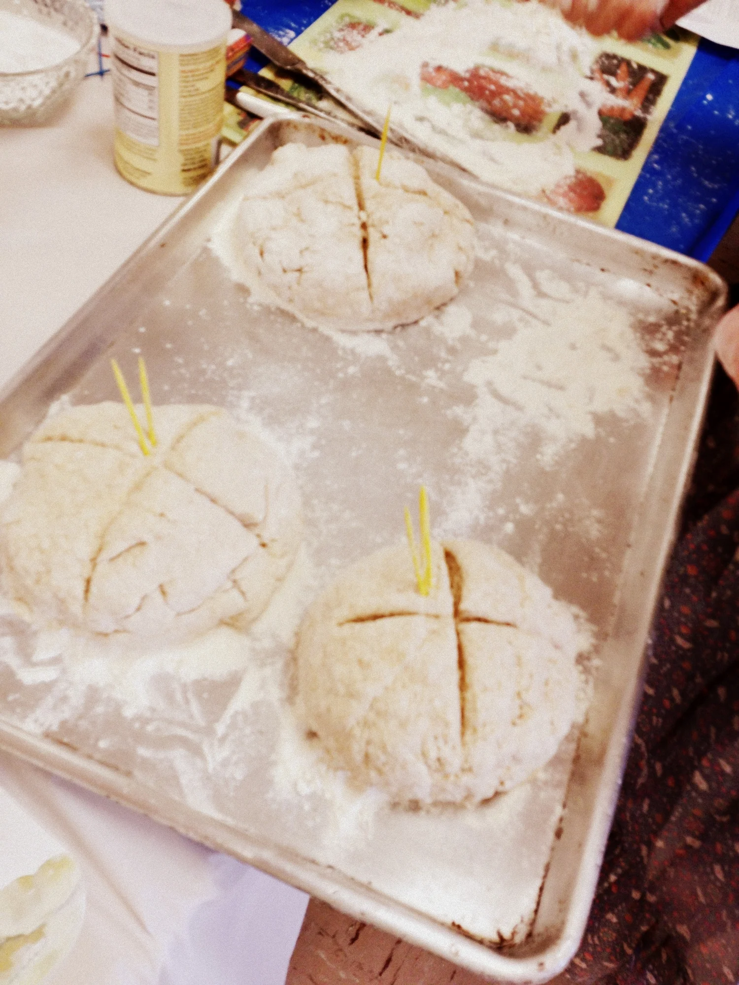  ...and stick it on a floured pan to bake. (Our toothpicks were to help us track down our individual loaves later.) 