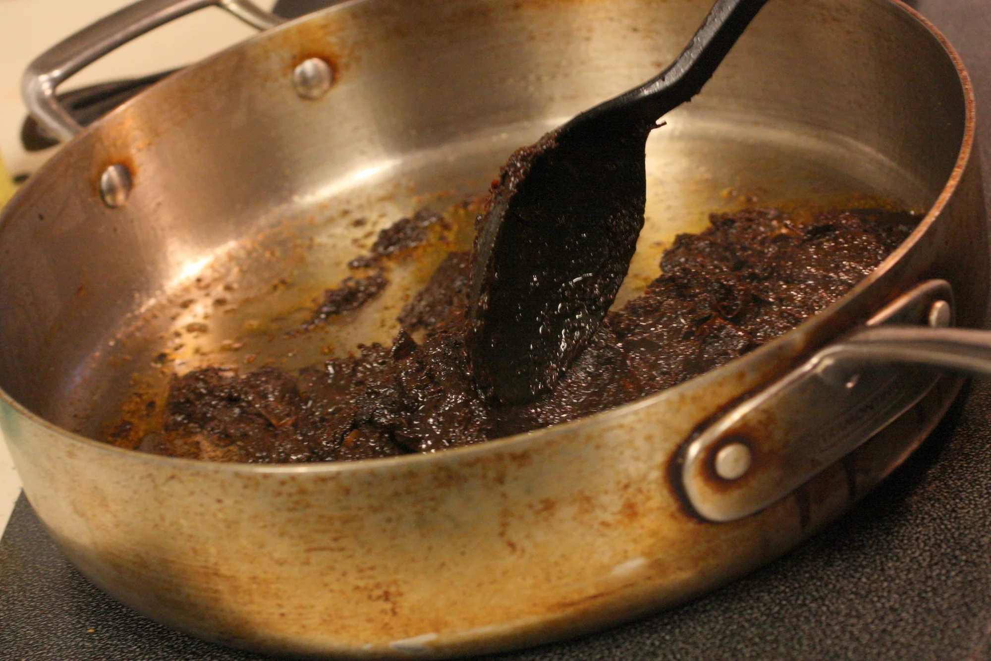  From there, we fried the pepper paste in oil, the added the other ingredient, broth and let it simmer. Amy noted that for the best possible mole when cooking from scratch, you will probably want to try to make it well in advance of serving so that y