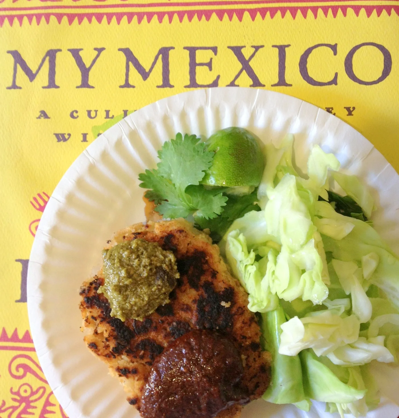  Our finished dish was mole sauces served on a delicious little bean cake, accompanied by a refreshing and simple cabbage salad dressed with lime. Again, check out Amy's site for more recipes or to pick up some of her powders. 