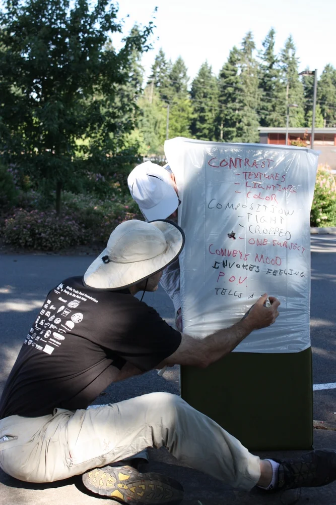  Here he used this makeshift white board to capture the thoughts of the class on what makes a good photograph. 