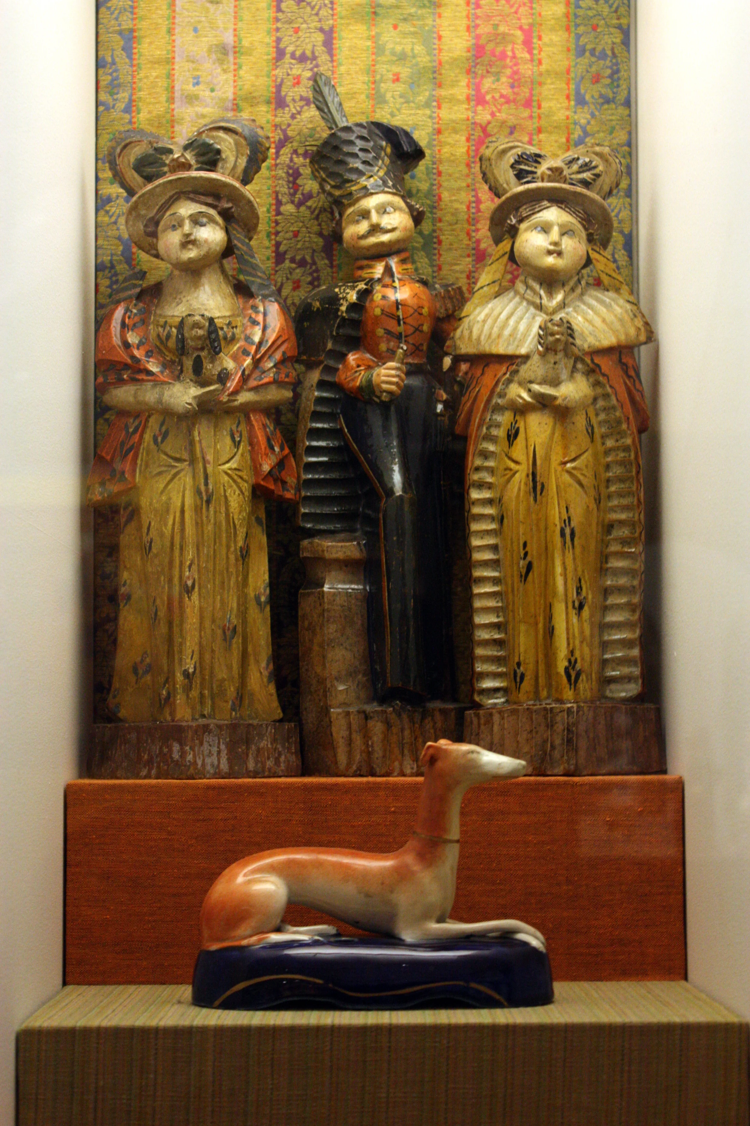  Figures at back are Sillies (Dury), 19th century caricatures of Russian aristocracy. The greyhound is British. 