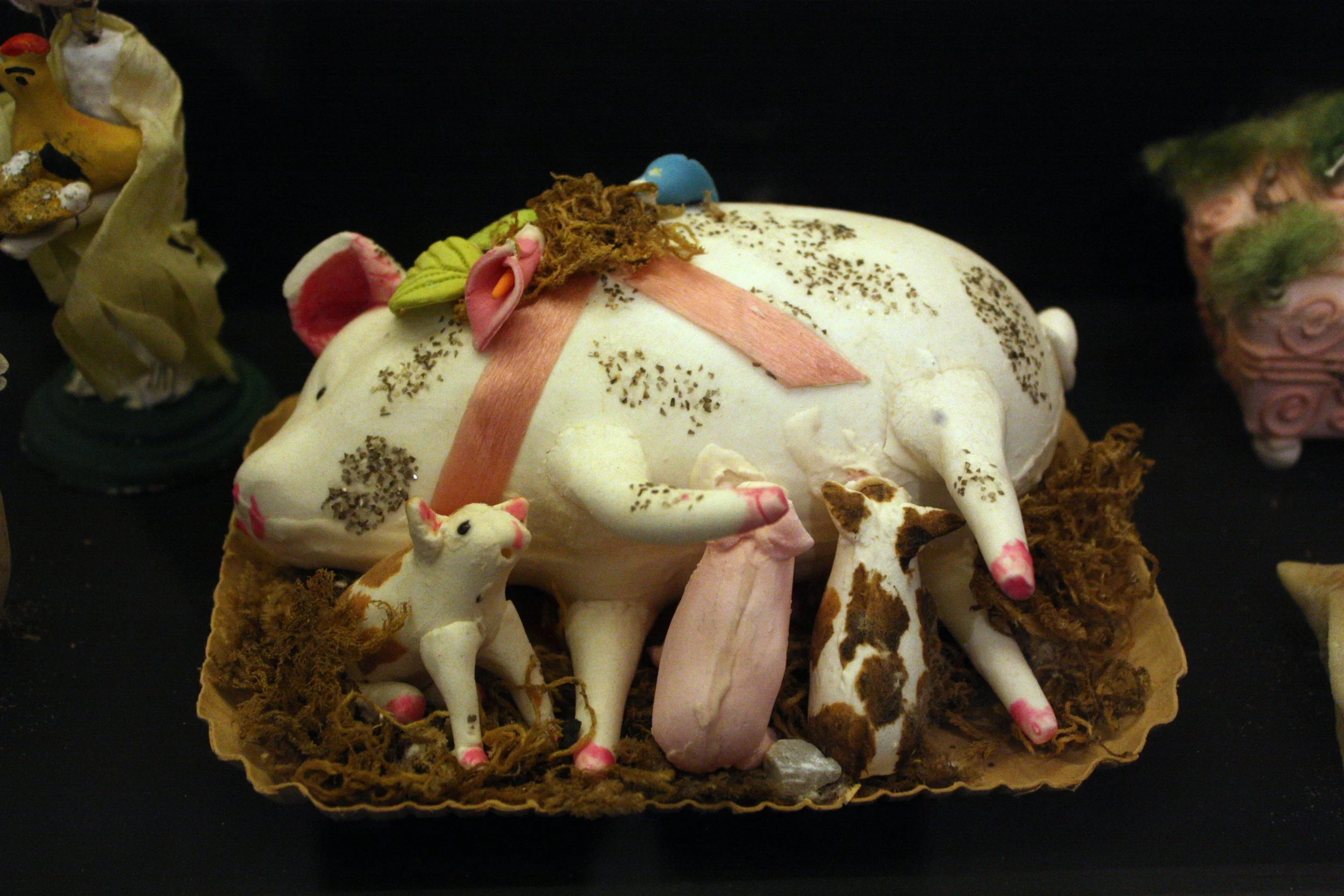  I saw two of these mama pigs with sucklings in the collection of Dia de los Muertos art. 