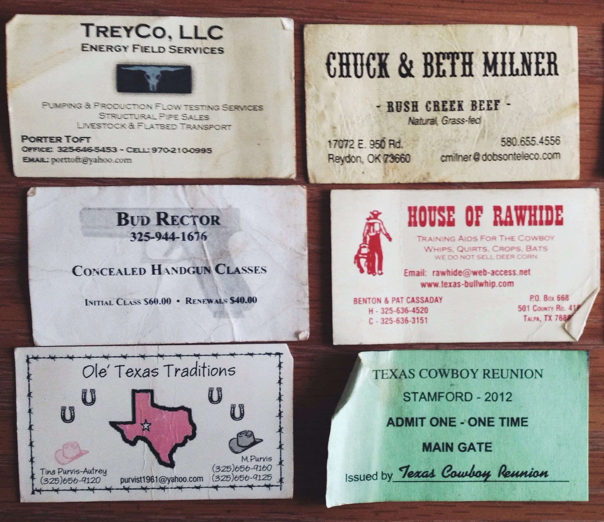  I had to tear apart the room to retrieve my cat from inside the box spring in the morning, and uncovered this collection of cowboy business cards. 