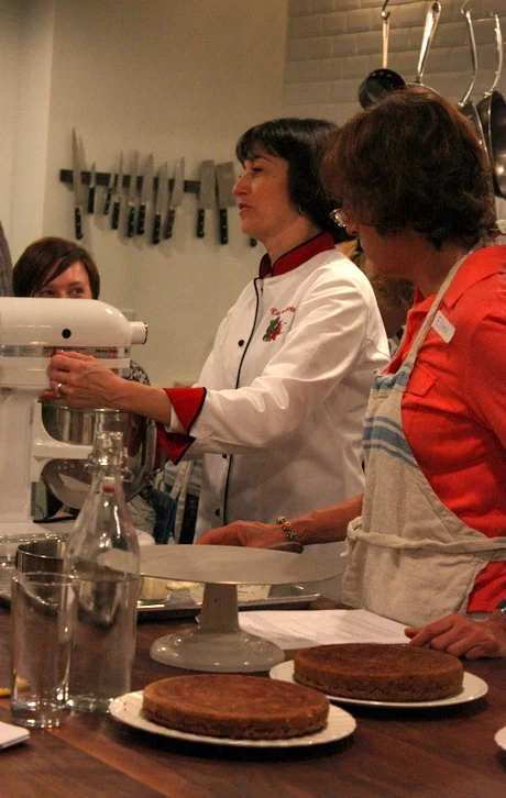  Diane whips up the icing. Some of her cake-making tips include putting a little bit of icing on the base to help keep the layers stick in place, and turning over the layers to use the flat bottoms as the tops. 