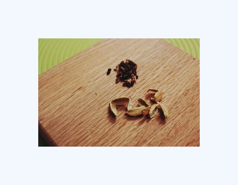  This recipe uses the husks from green cardamom, so a good way to use them up if you're using the seeds. 