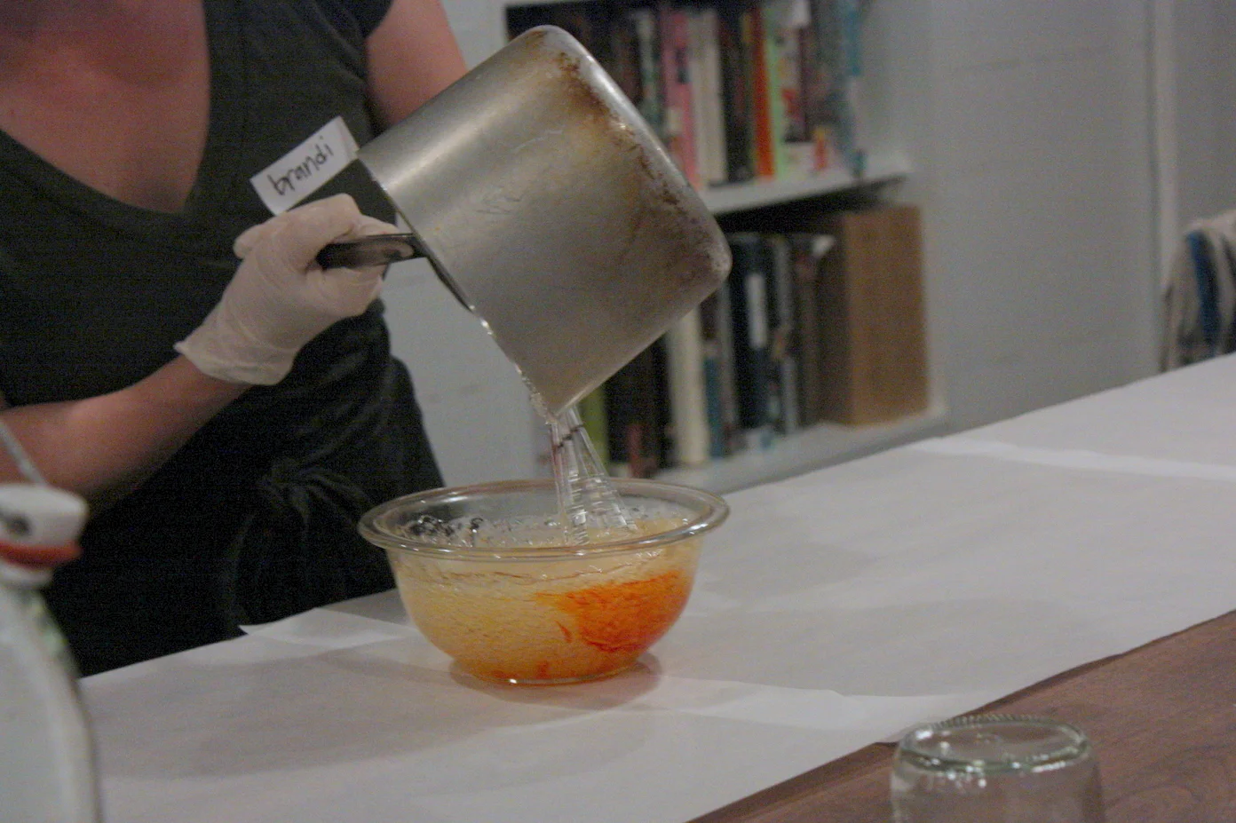  After heating up the sugar to precisely 310 degrees (any hotter and it will caramelize, which is usually delicious, but for cotton candy, you want pure clean sweetness in your sugar syrup), she quickly stirred it into a mixture of food coloring and 