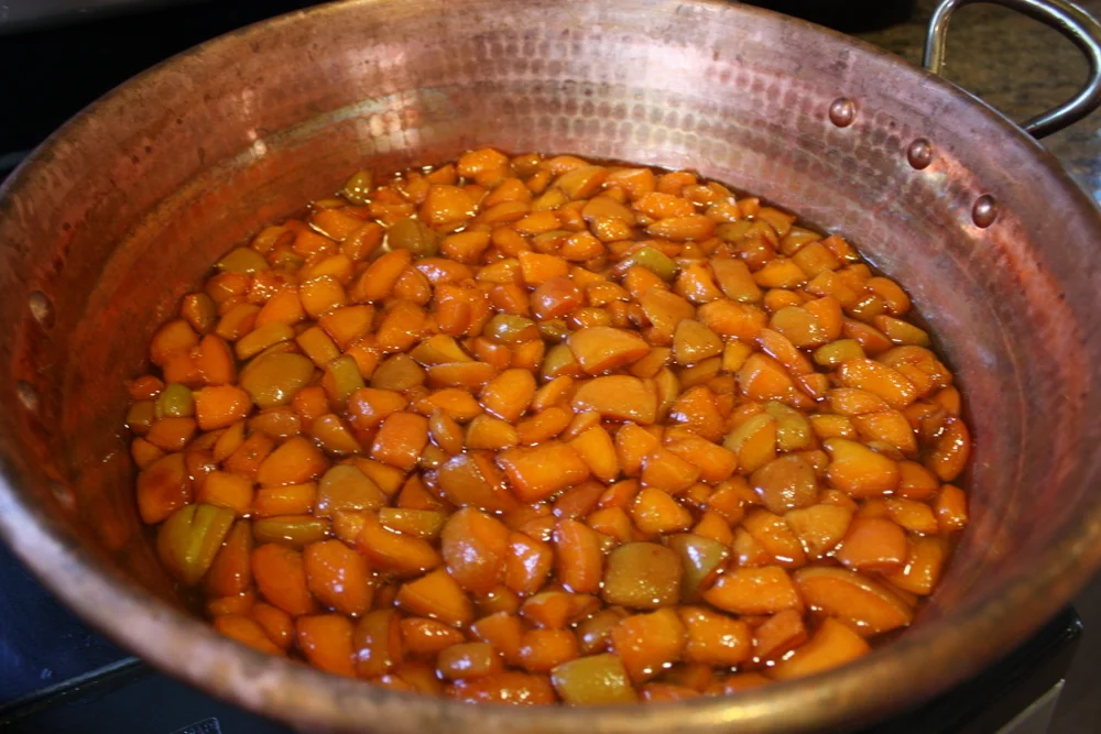  Here Brook did a swap out - ideally the apricots should sit in the sugar for several hours or overnight. So she brought in some pre-macerated apricots and starting the cooking process in this excellent, wide, shallow, and heavy copper pot she brough