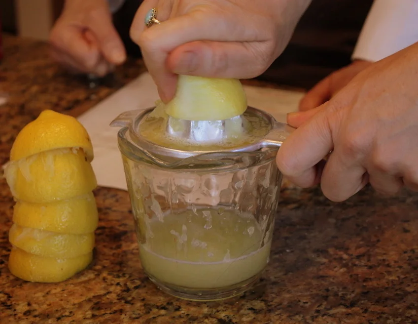  We didn't realize there wasn't a juicer in the kitchen, but one of the residents lent us her own, and the women made quick work of the lemons called for in the recipe. 